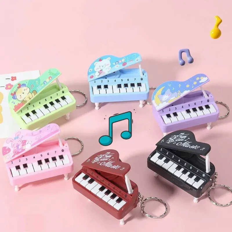 Kids Education Music - พวงกุญแจเปียโนตั้งโต๊ะขนาดเล็กน่ารัก, เครื่องเล่นเกมดนตรีขนาดเล็กหลากสีสัน, ของเล่นเสริมพัฒนาการที่สนุกสนาน เหมาะเป็นของขวัญสำหรับเด็กชายและเด็กหญิง